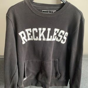 YOUNG AND RECKLESS SWEATER